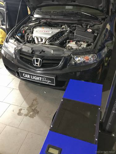 Процесс регулировки фар Honda