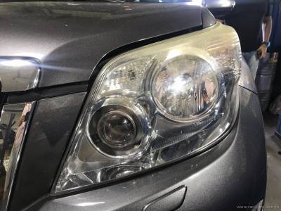 Стекло фары Toyota Prado до полировки