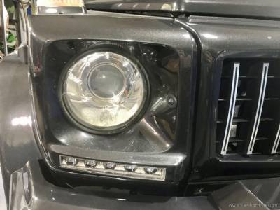 Разбитое стекло фары Mercedes-Benz G63